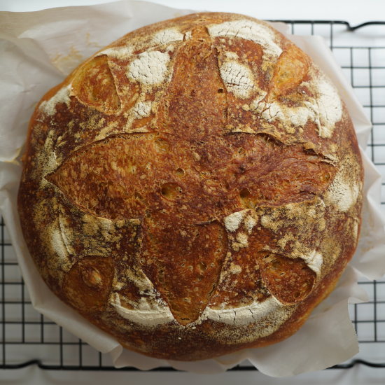 Top down view of the loaf on a cooling rack